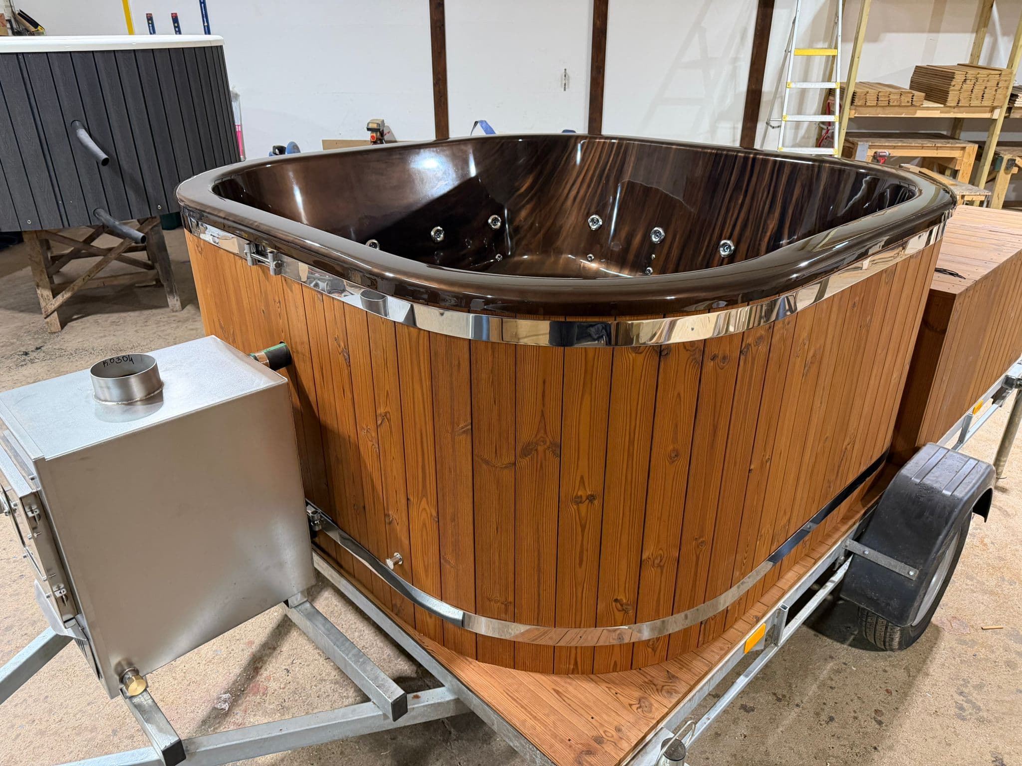 Brown mobile hot tub on trailer — exterior view